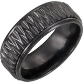 A black ring with a pattern on it